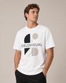 Man wearing a white t-shirt with a logo and text on a beige background