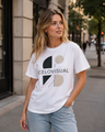 Woman wearing a white t-shirt with a logo on a city street