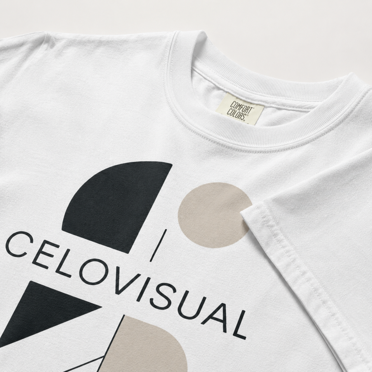 White t-shirt with geometric design and 'CELIOVISUAL' branding on a white background