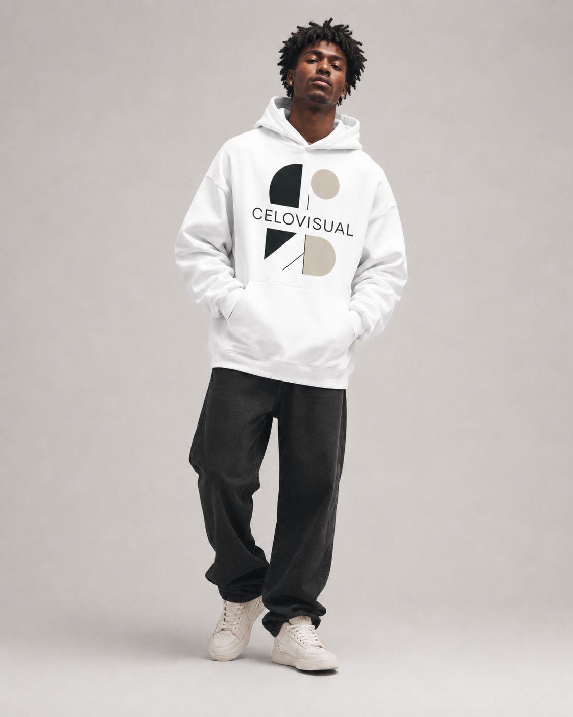 Person wearing a white hoodie with a logo and text on a gray background