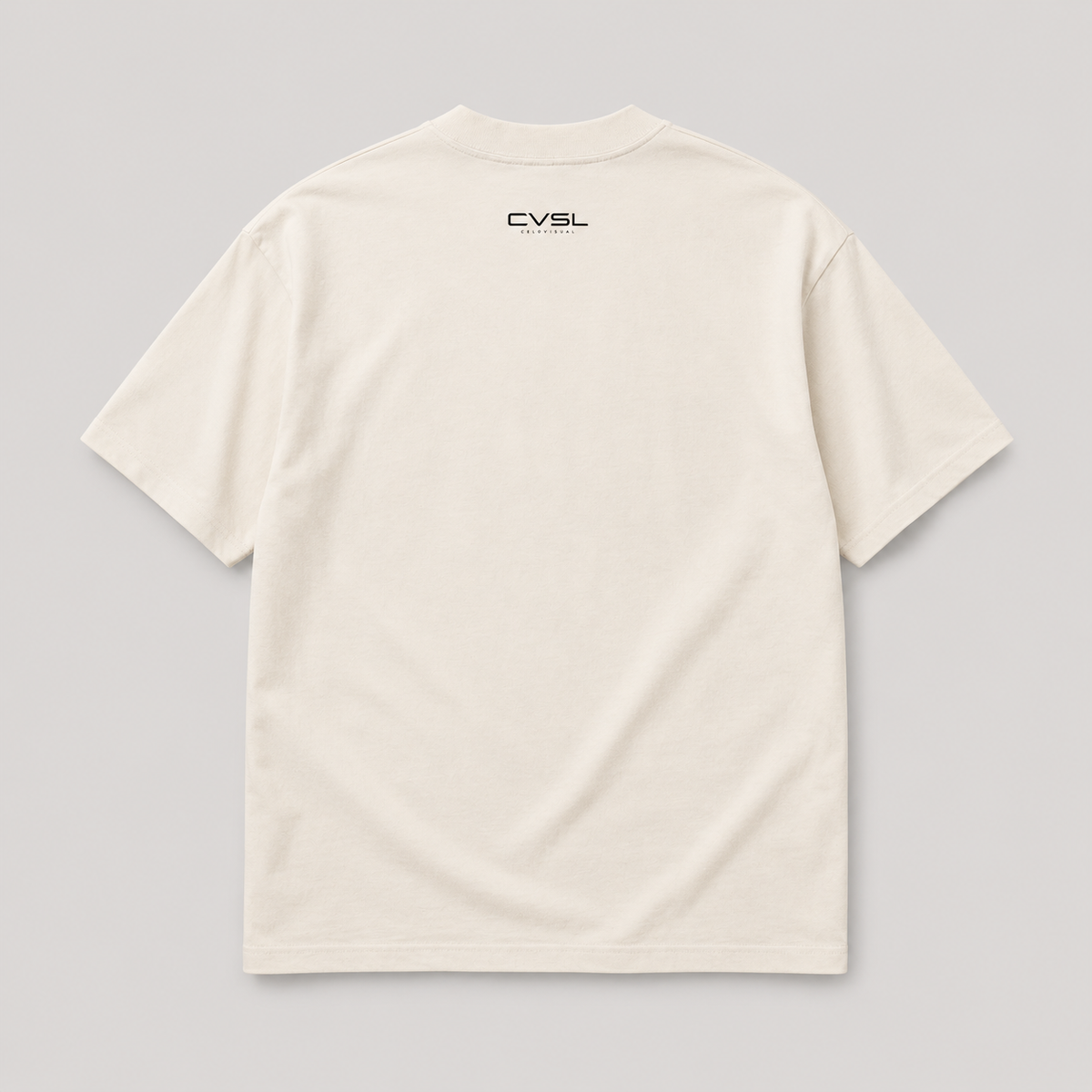Beige t-shirt with 'CVSL' logo on the back against a gray background