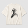 Beige t-shirt with black abstract design and text on a light gray background