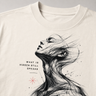 T-shirt with artistic design of a woman's face and text 'What is hidden still speaks' on a plain background