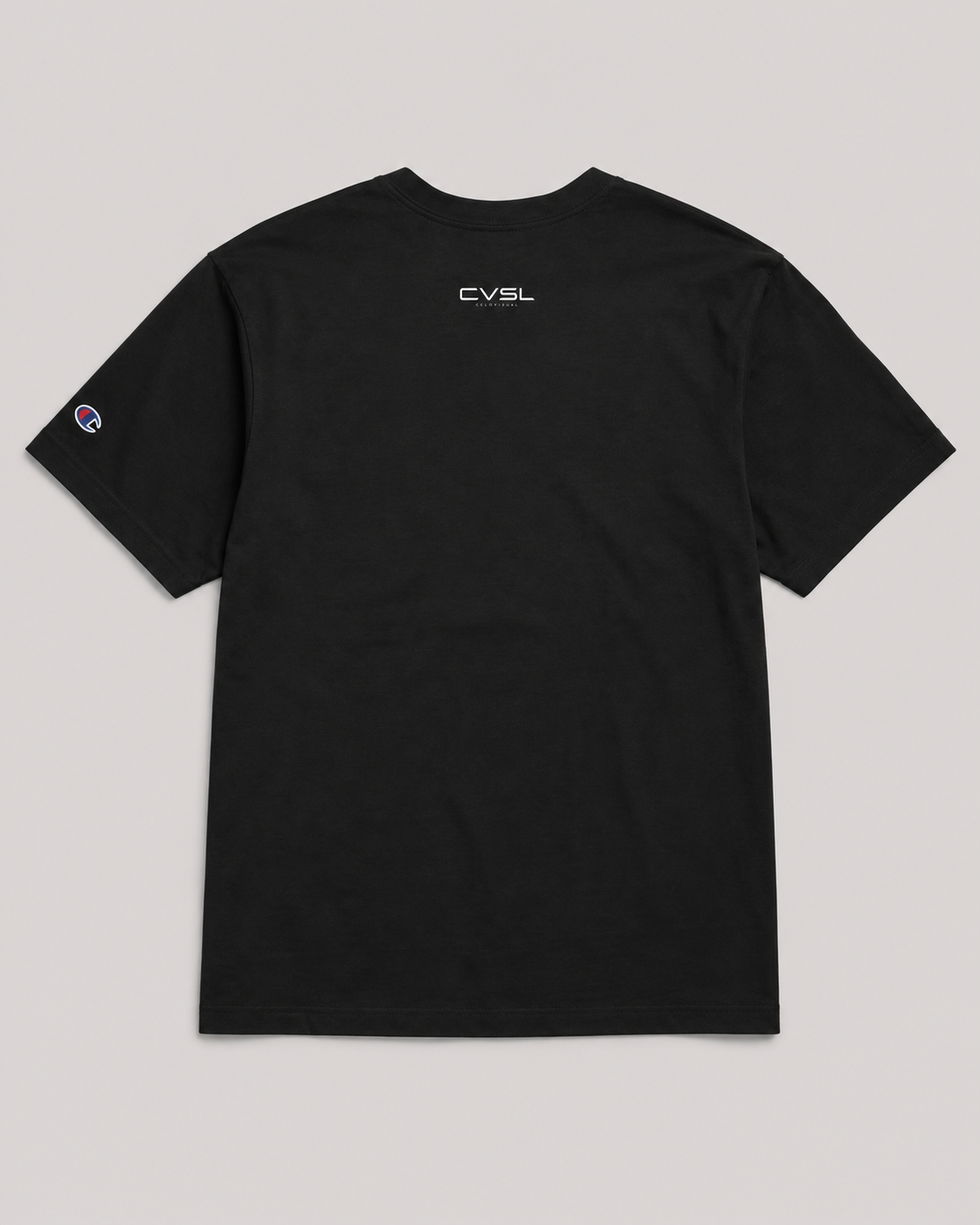 Black t-shirt with a logo on the back against a gray background