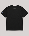 Black t-shirt with a logo on the back against a gray background