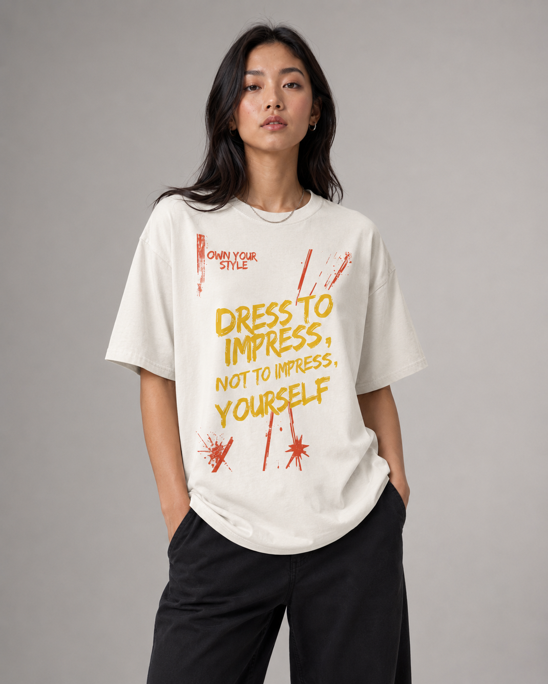 Person wearing a white t-shirt with a motivational quote on a gray background