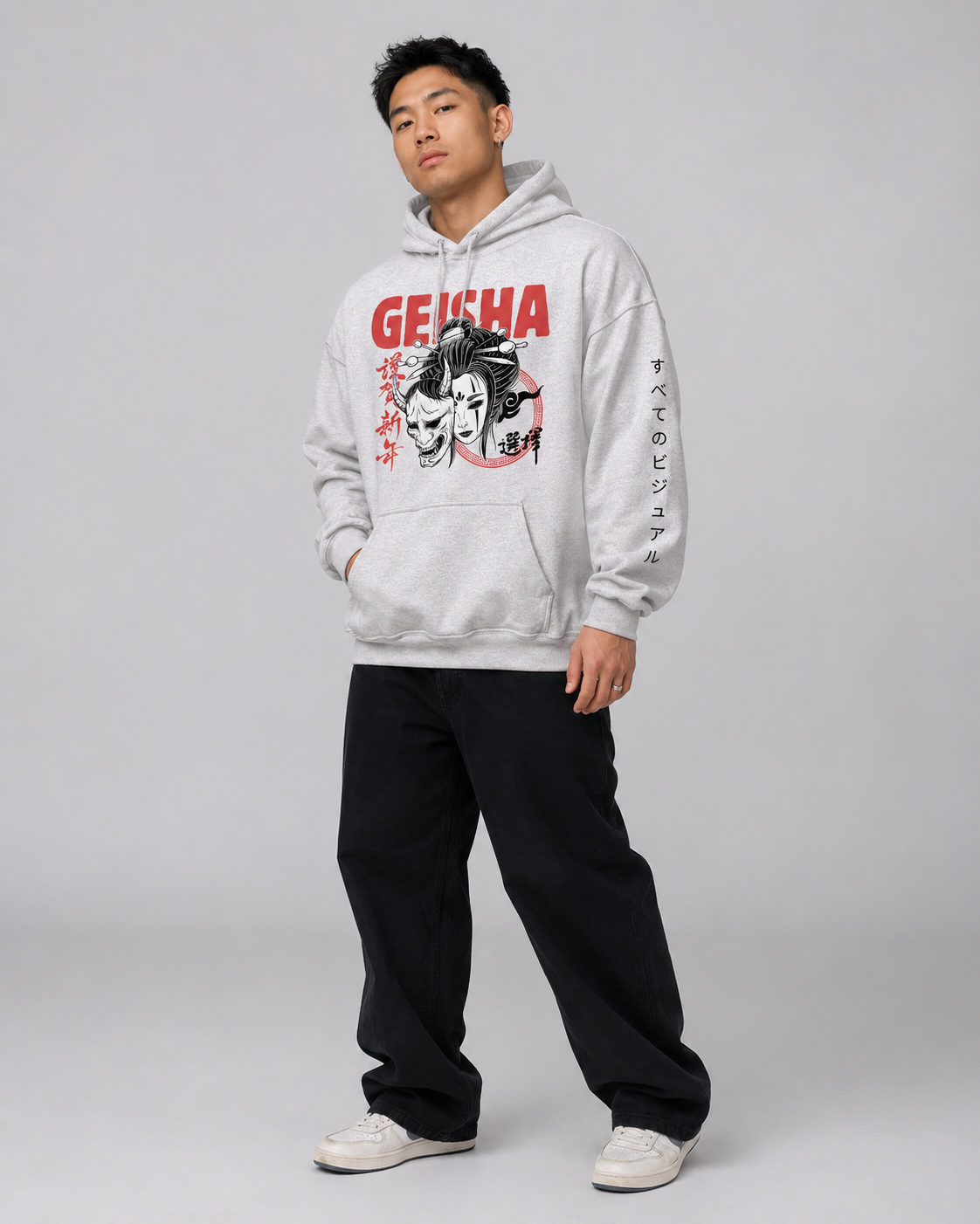 Person wearing a gray hoodie with 'Geisha' design on a plain background