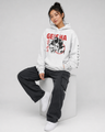 Person wearing a white hoodie with red and black graphics on a white background