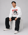 Person wearing a white hoodie with 'GEISHA' design, sitting on a white block against a gray background