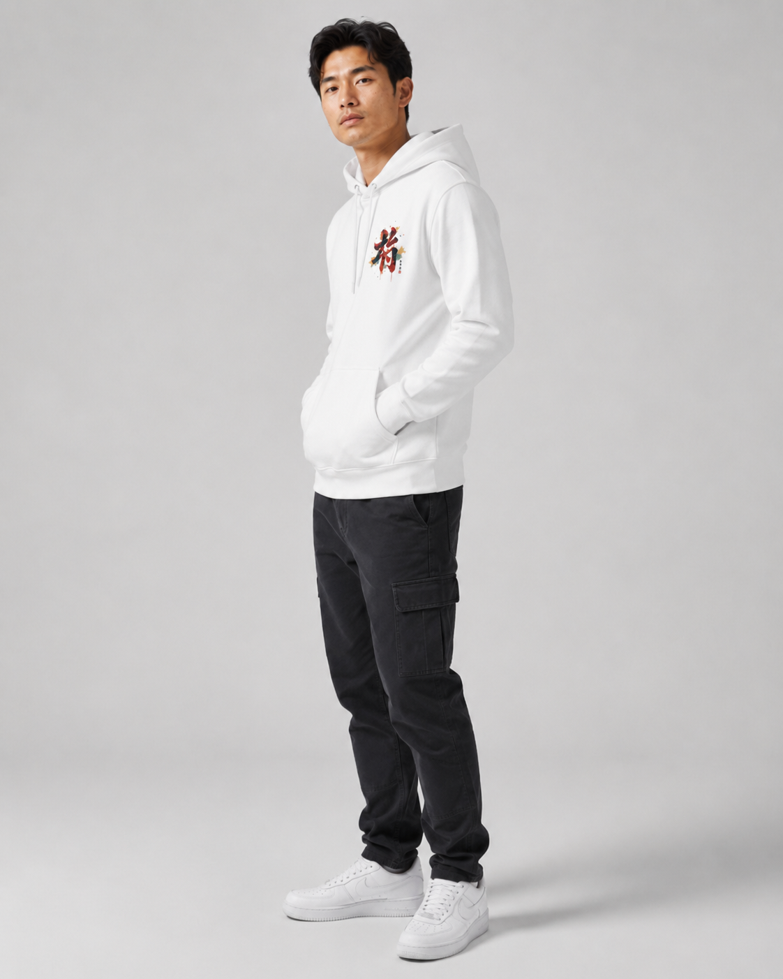 Person wearing a white hoodie with a logo on a gray background