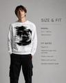 Man wearing a white sweatshirt with black graphic design on a gray background