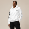 Model wearing a white hoodie with text and black pants on a beige background