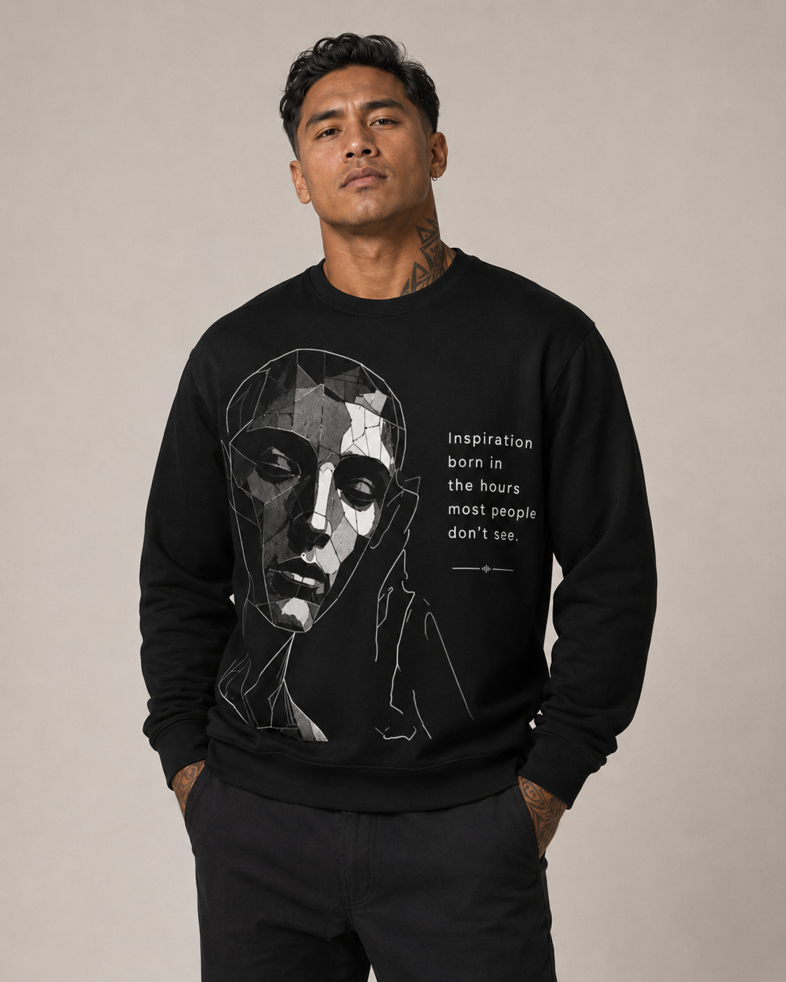 Man wearing a black sweatshirt with a graphic design and text on a beige background