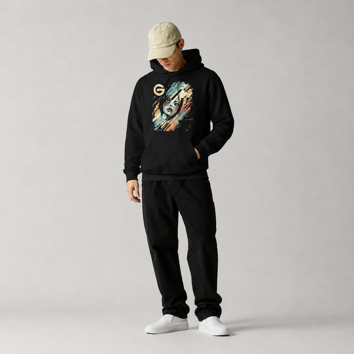 Person wearing a black hoodie with a graphic design and black pants on a gray background