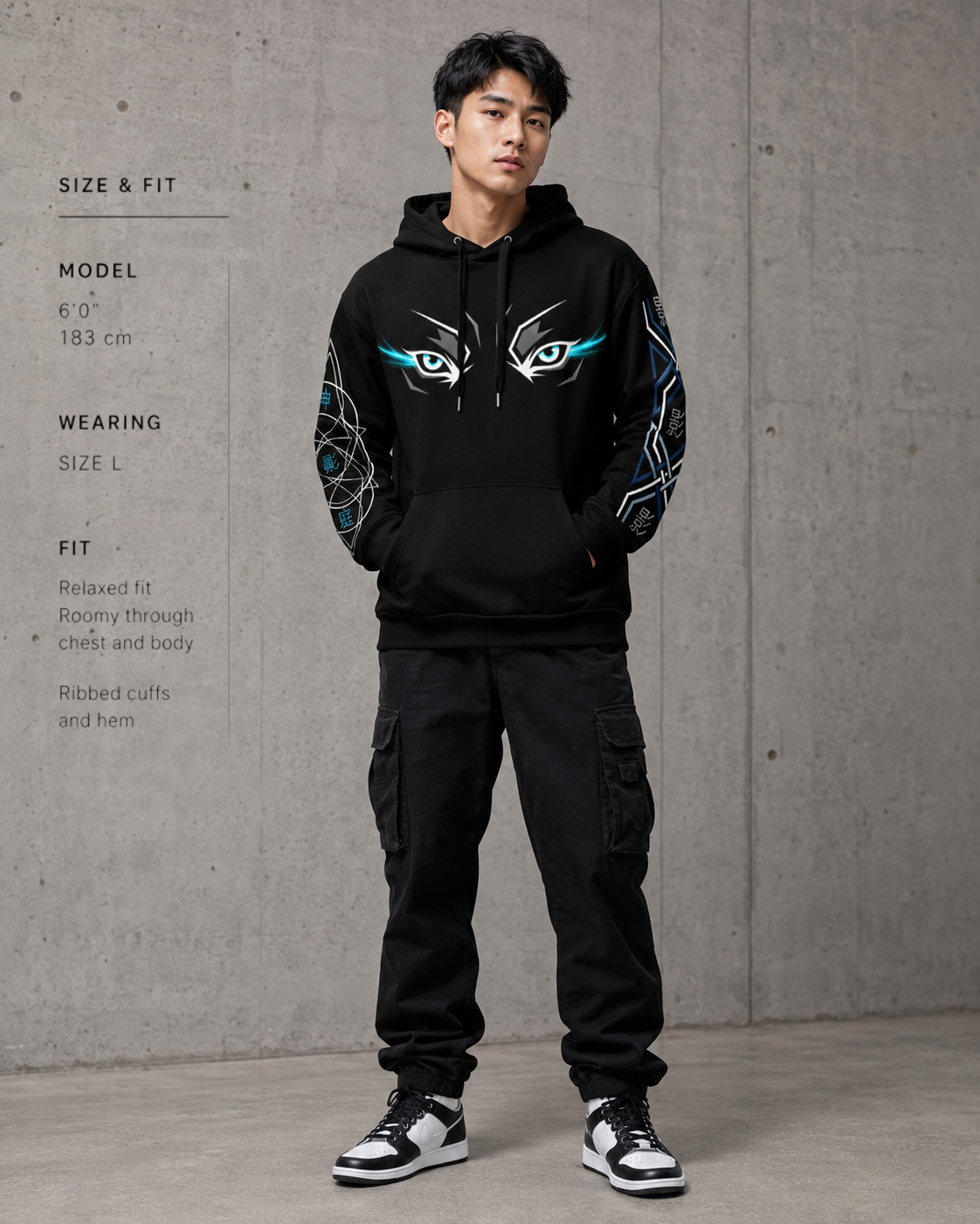 Person wearing a black hoodie with red and white designs on a gray background