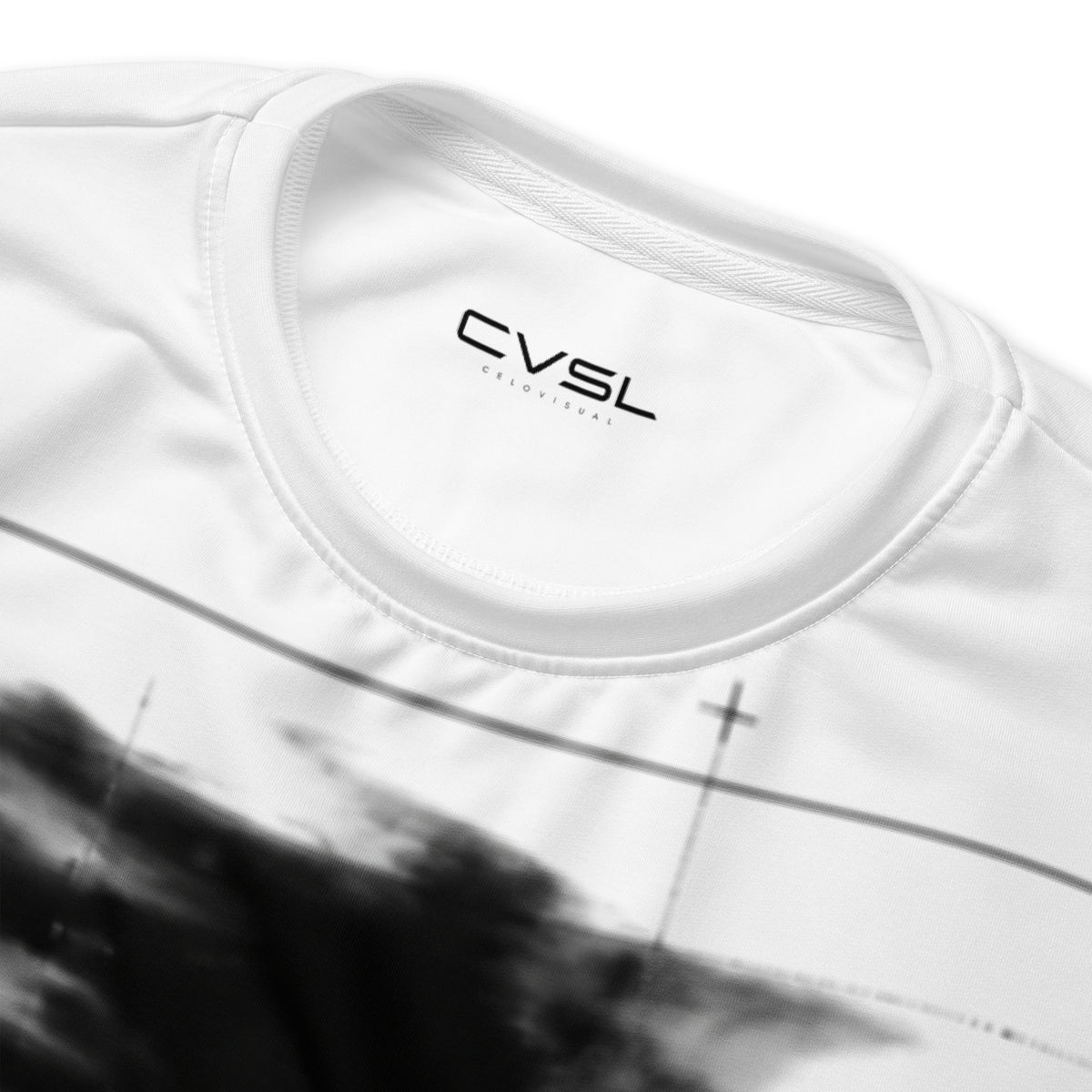 White t-shirt with 'CVSL' logo on a blurred background