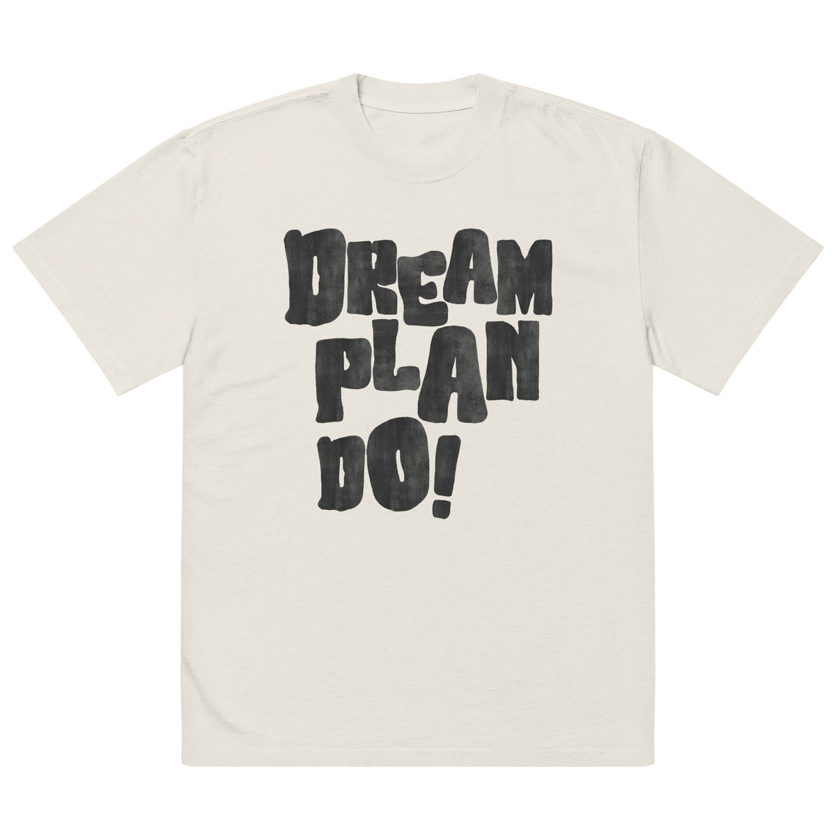 Beige t-shirt with 'Dream Plan Do!' text on a white background