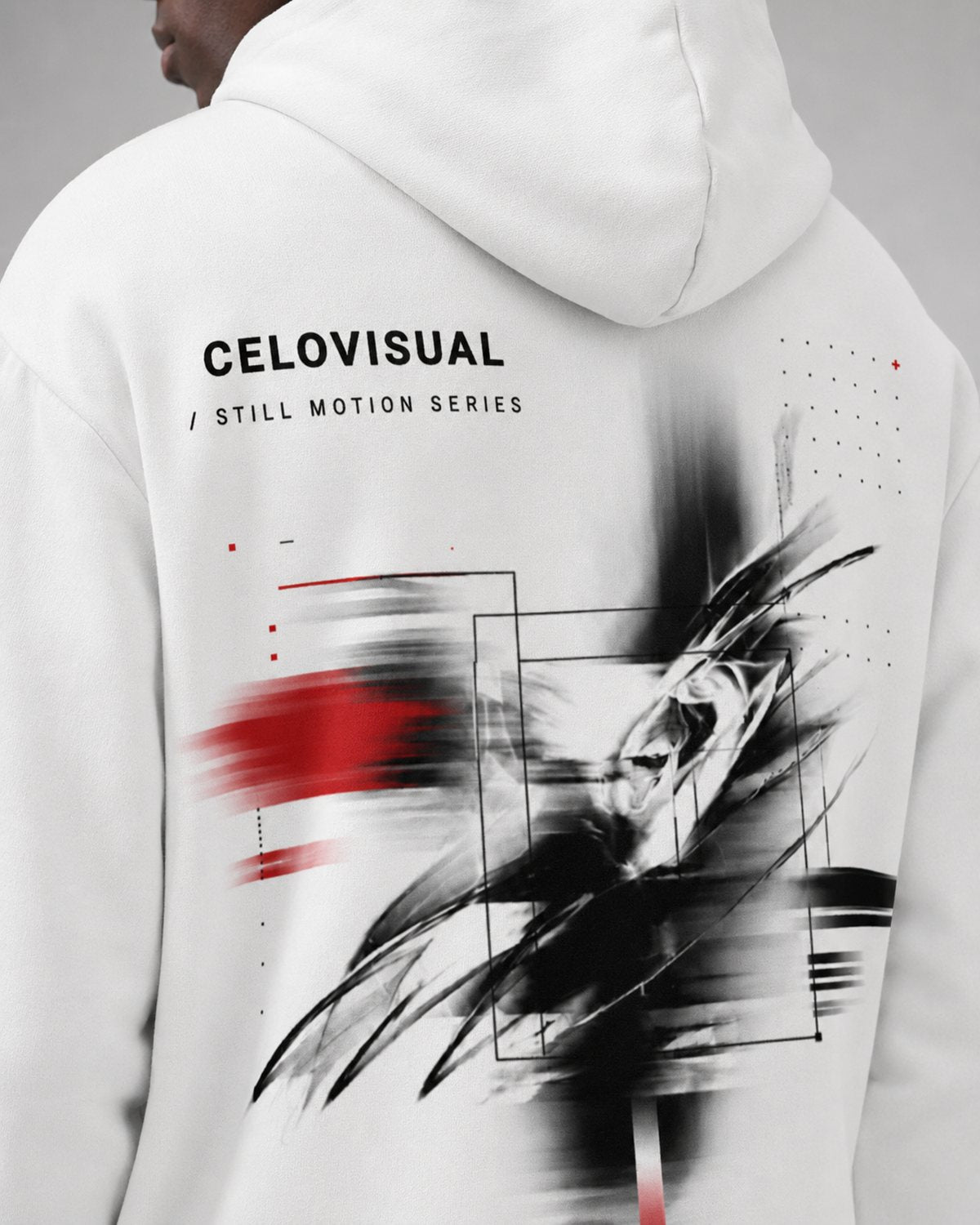 White Celovisual graphic hoodie shown from the back with a bold black and red abstract artwork